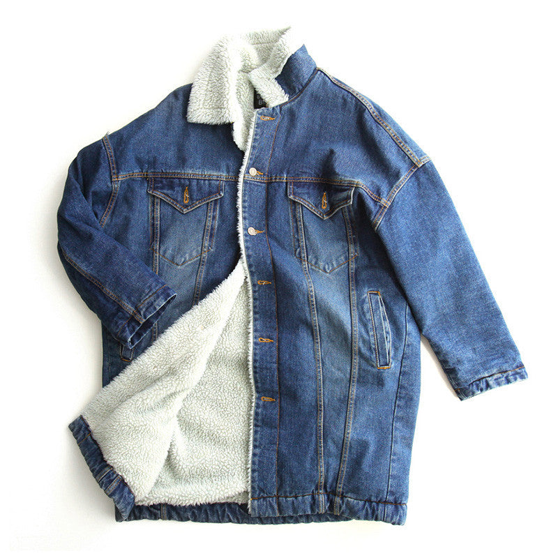Blue denim jacket with white sherpa lining on a white background