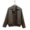 Brown leather jacket on a hanger against a white background